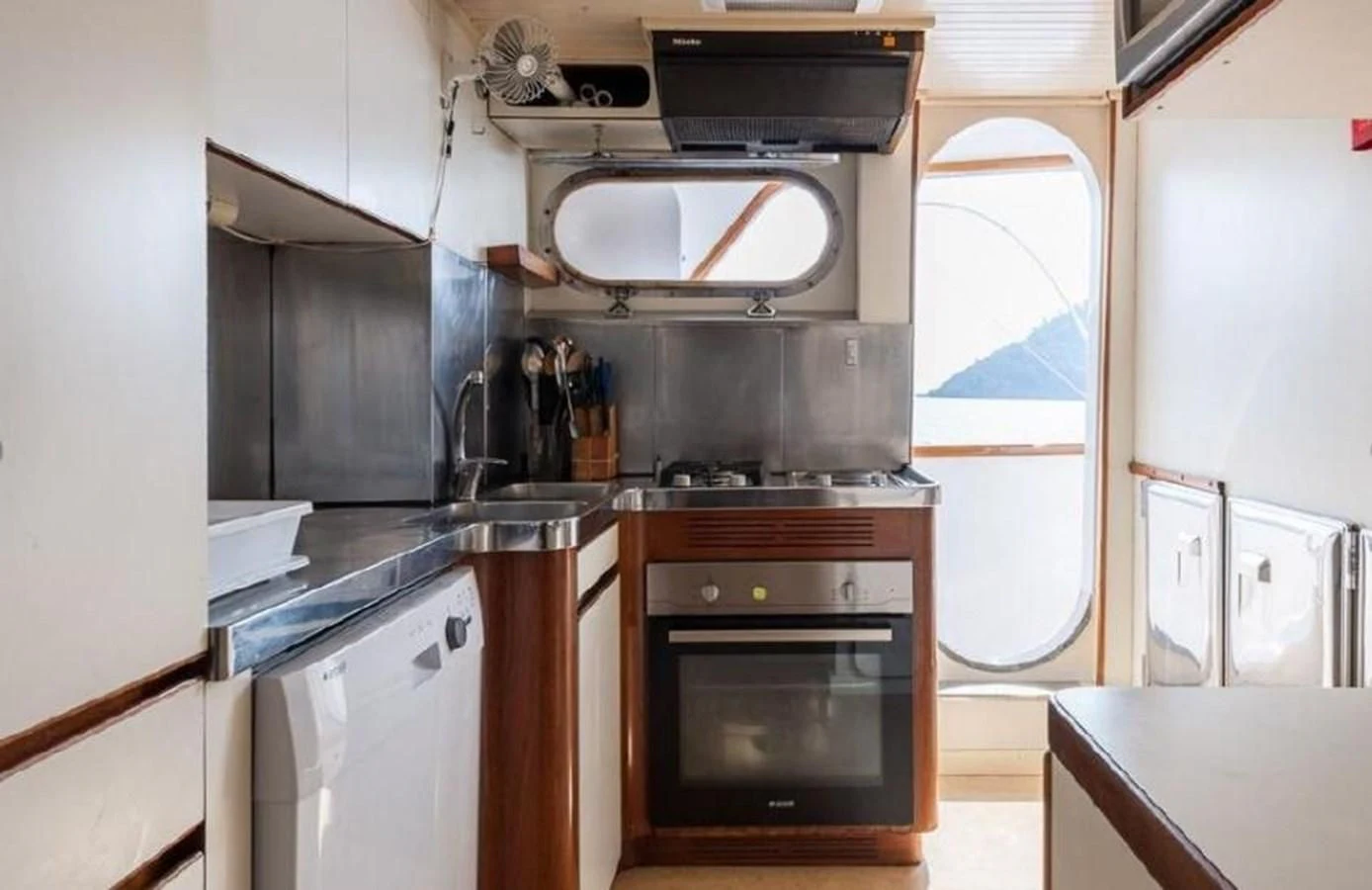 a kitchen with a stove and oven aboard LADYAR B Yacht for Sale