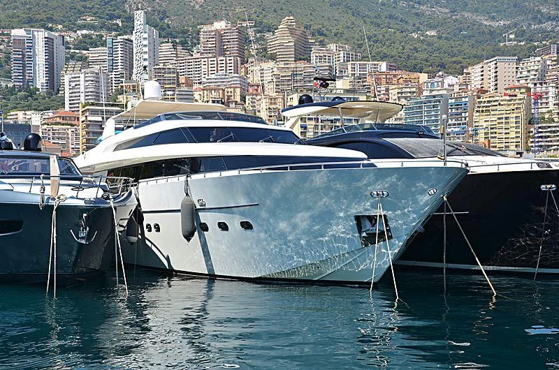 a couple of boats sit in a harbor aboard MIRI Yacht for Sale