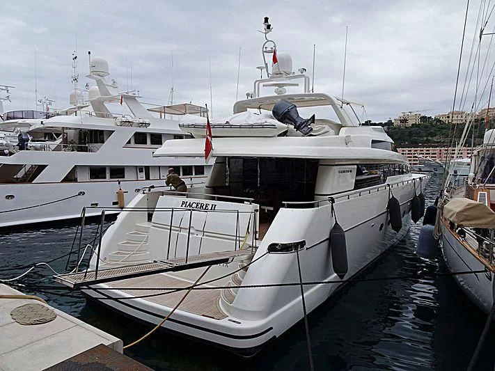 a boat docked at a pier aboard MIRI Yacht for Sale