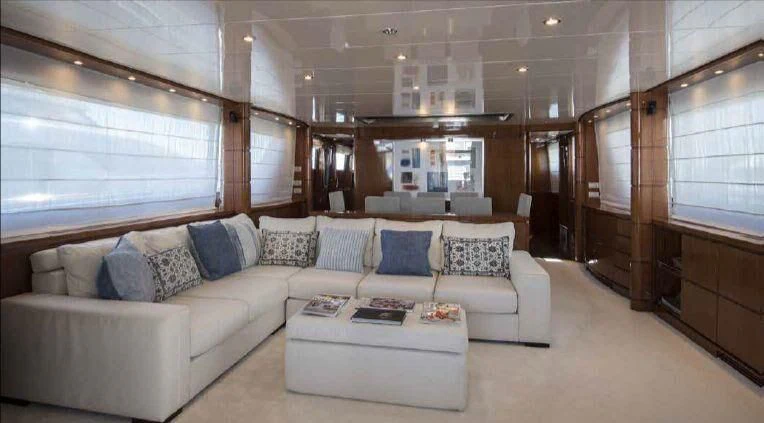 a living room with a couch and a table aboard MIRI Yacht for Sale