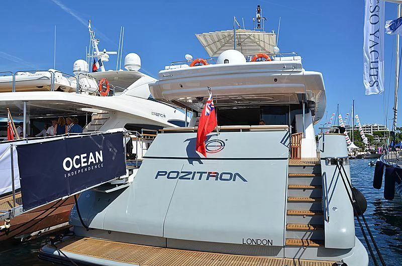 a boat with a flag on the deck aboard MEGI ONE Yacht for Sale