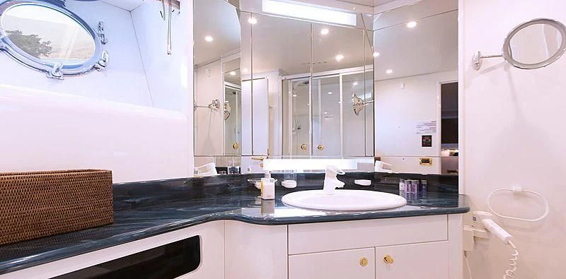 a kitchen with a countertop sink and cabinets aboard MEGI ONE Yacht for Sale