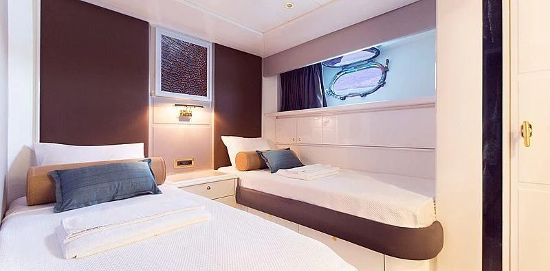 a room with two beds aboard MEGI ONE Yacht for Sale