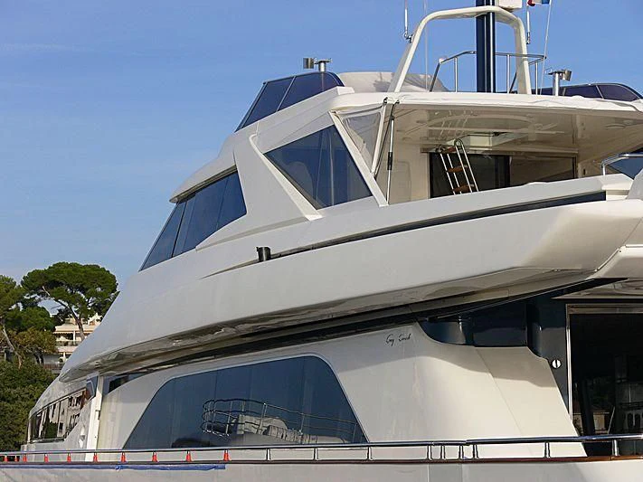 a white yacht with a blue sky aboard MEGI ONE Yacht for Sale