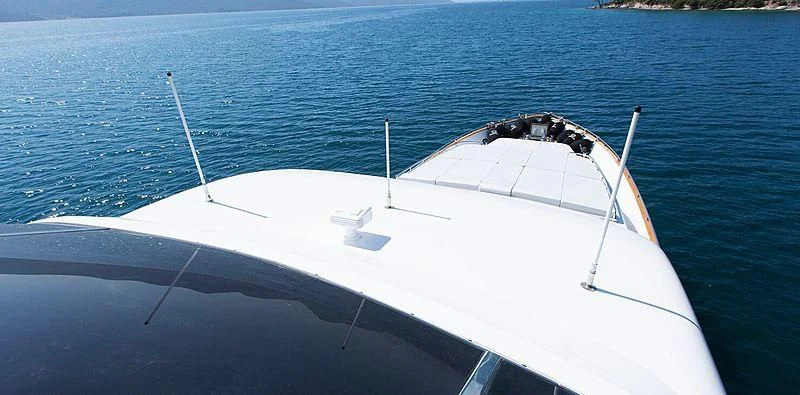 a white boat in the water aboard MEGI ONE Yacht for Sale
