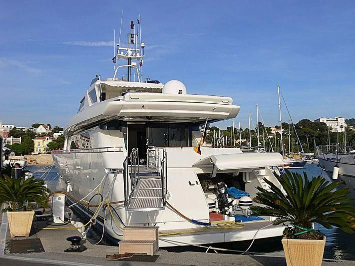 a white boat with a ladder on the deck aboard MEGI ONE Yacht for Sale