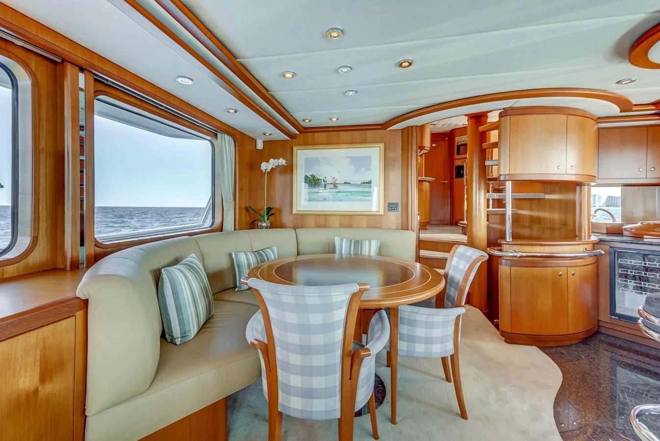 a train car with a table and chairs aboard GUSTO Yacht for Sale