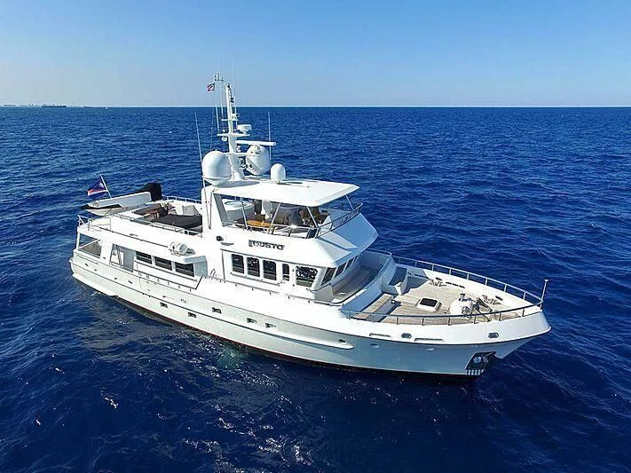 a white boat in the water aboard GUSTO Yacht for Sale