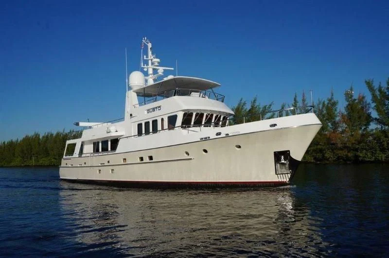 a large white boat on the water aboard GUSTO Yacht for Sale