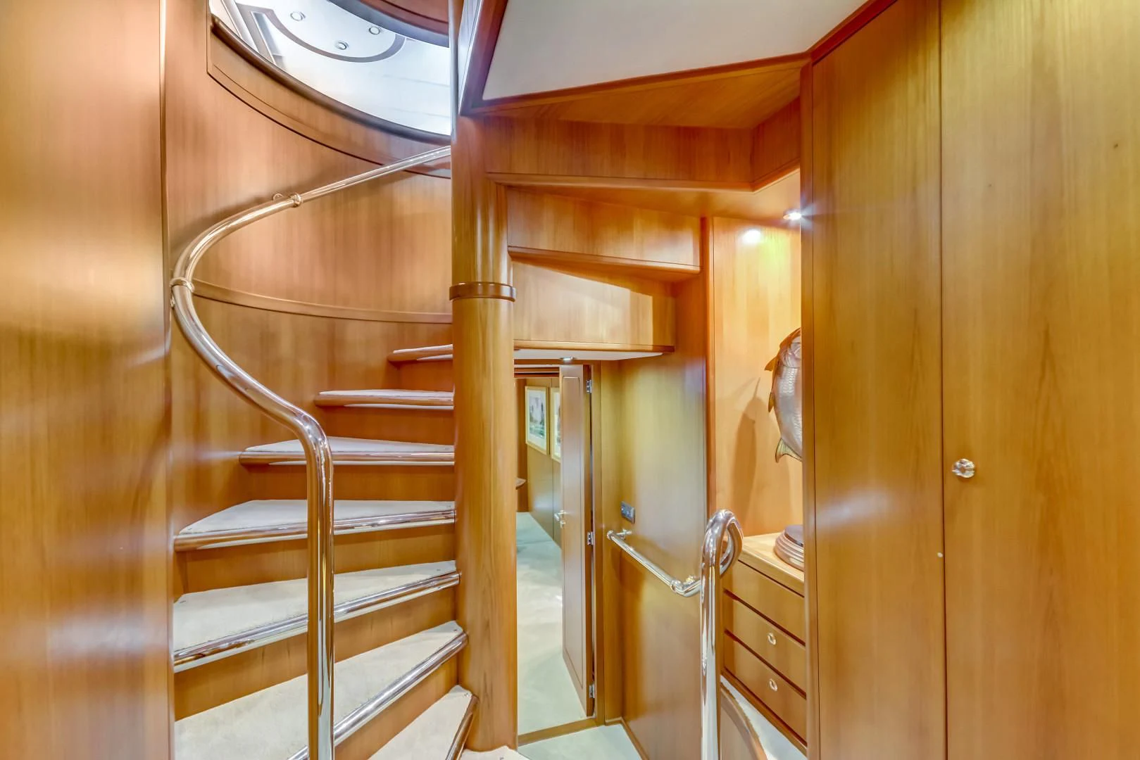 a wooden staircase in a house aboard GUSTO Yacht for Sale