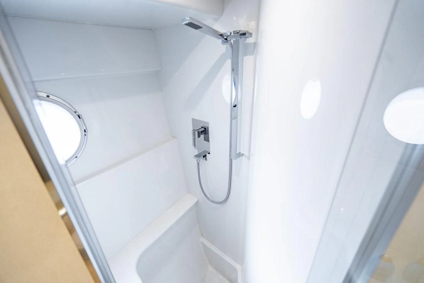a white bathroom with a large mirror aboard MAYA Yacht for Sale