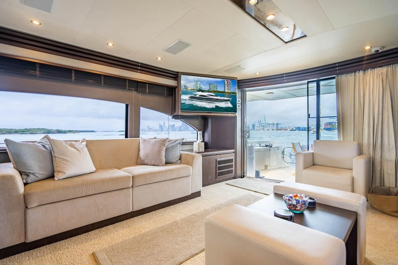 a living room with a large window aboard MAYA Yacht for Sale