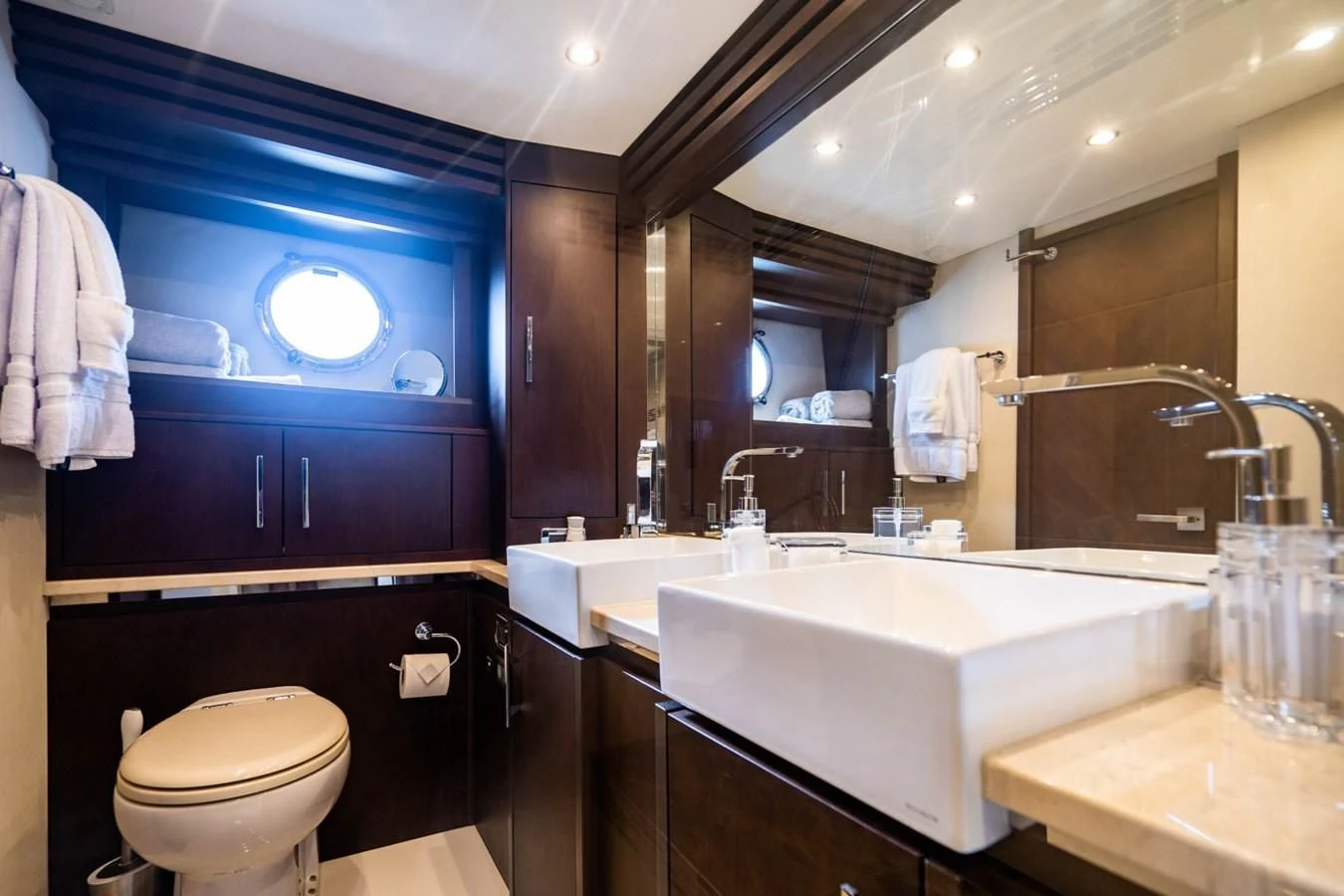 a bathroom with a sink toilet and a bathtub aboard MAYA Yacht for Sale