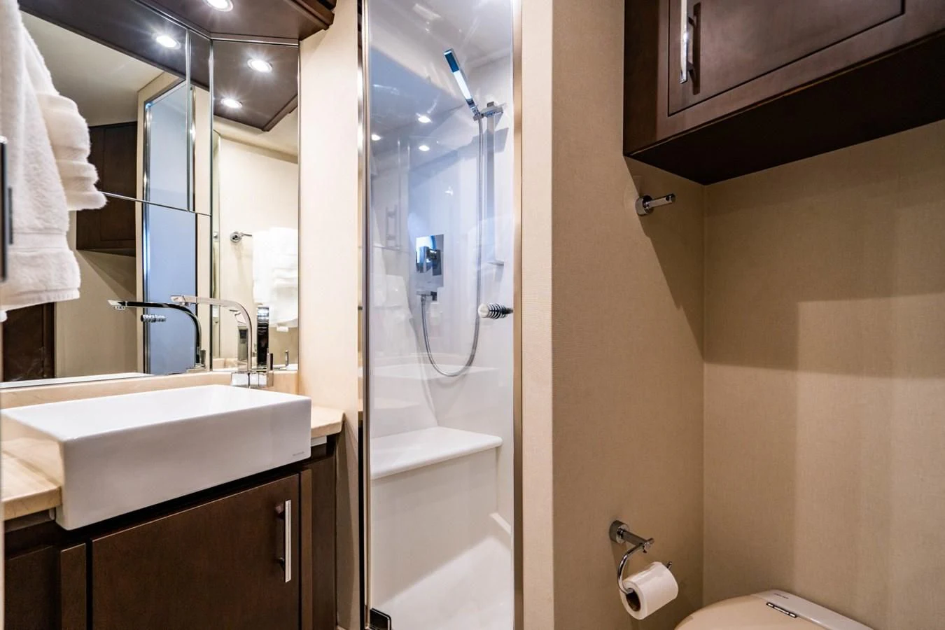 a bathroom with a glass shower door aboard MAYA Yacht for Sale