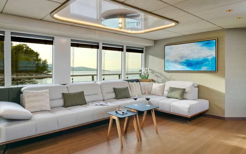 a living room with a large window aboard ANIMA MARIS Yacht for Sale