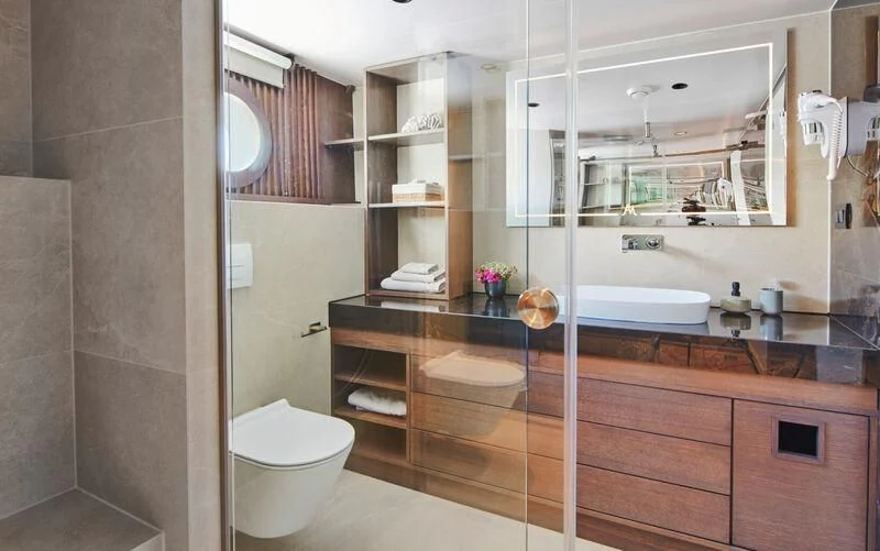 a bathroom with a tub sink and toilet aboard ANIMA MARIS Yacht for Sale
