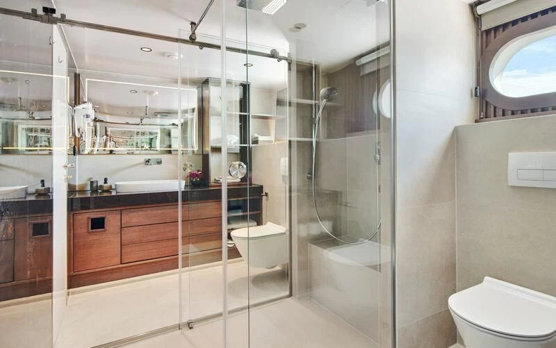 a bathroom with a glass shower aboard ANIMA MARIS Yacht for Sale
