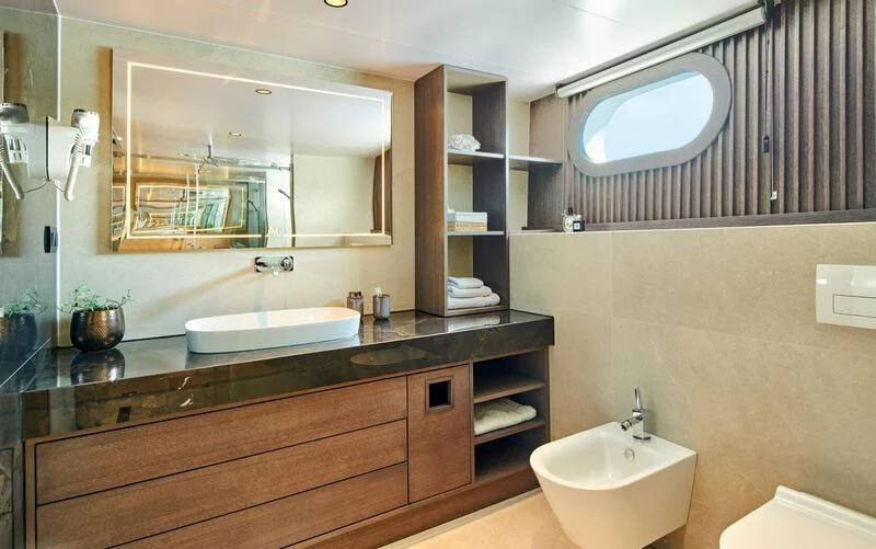 a bathroom with a large mirror aboard ANIMA MARIS Yacht for Sale