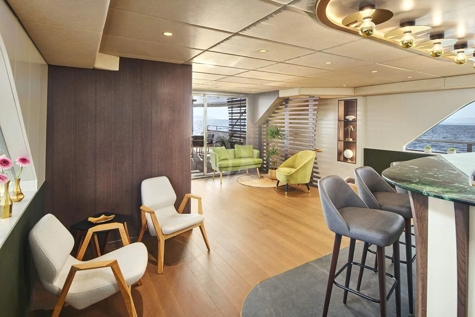 a room with a table chairs and a large window aboard ANIMA MARIS Yacht for Sale