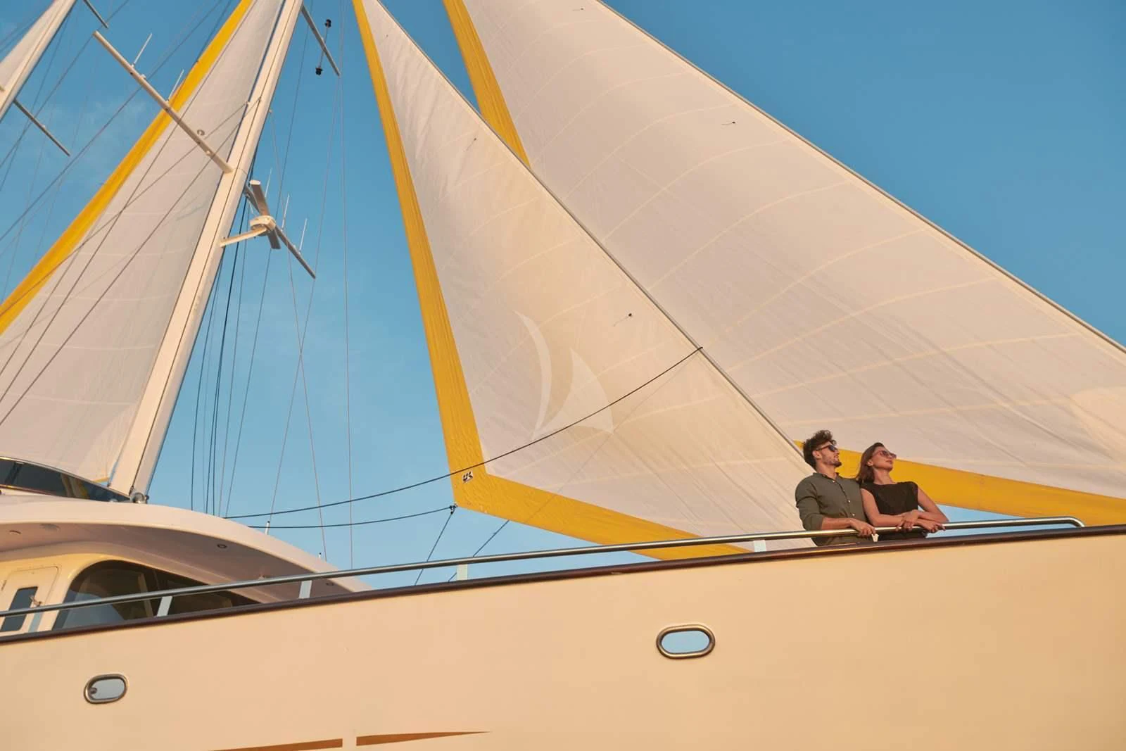 a couple of people sitting on a sailboat aboard ANIMA MARIS Yacht for Sale
