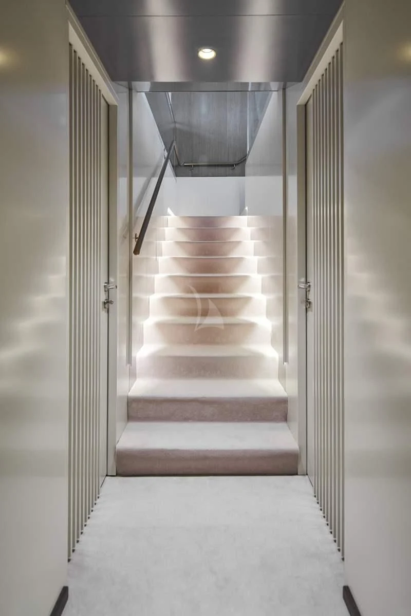 a hallway with a door and a glass door aboard ANIMA MARIS Yacht for Sale