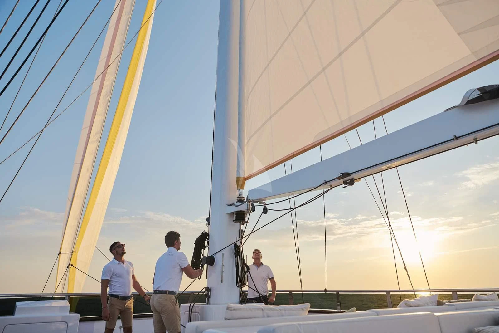 a group of people standing on a boat deck aboard ANIMA MARIS Yacht for Sale