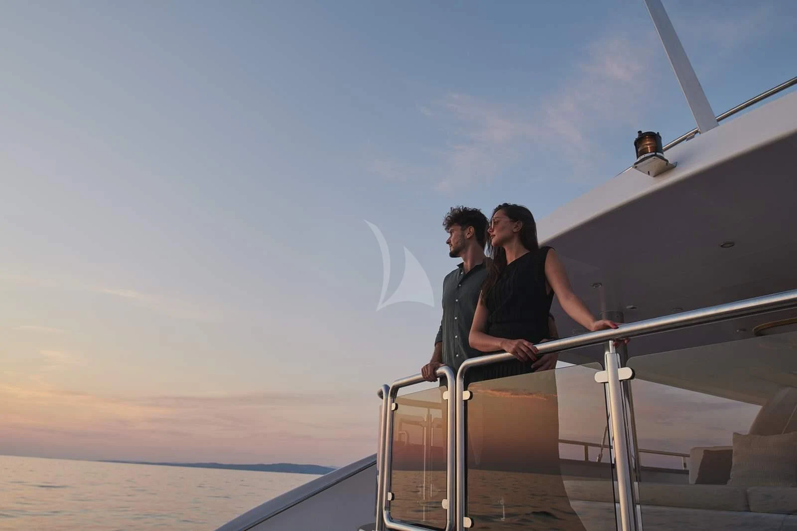a man and woman sitting on a boat aboard ANIMA MARIS Yacht for Sale