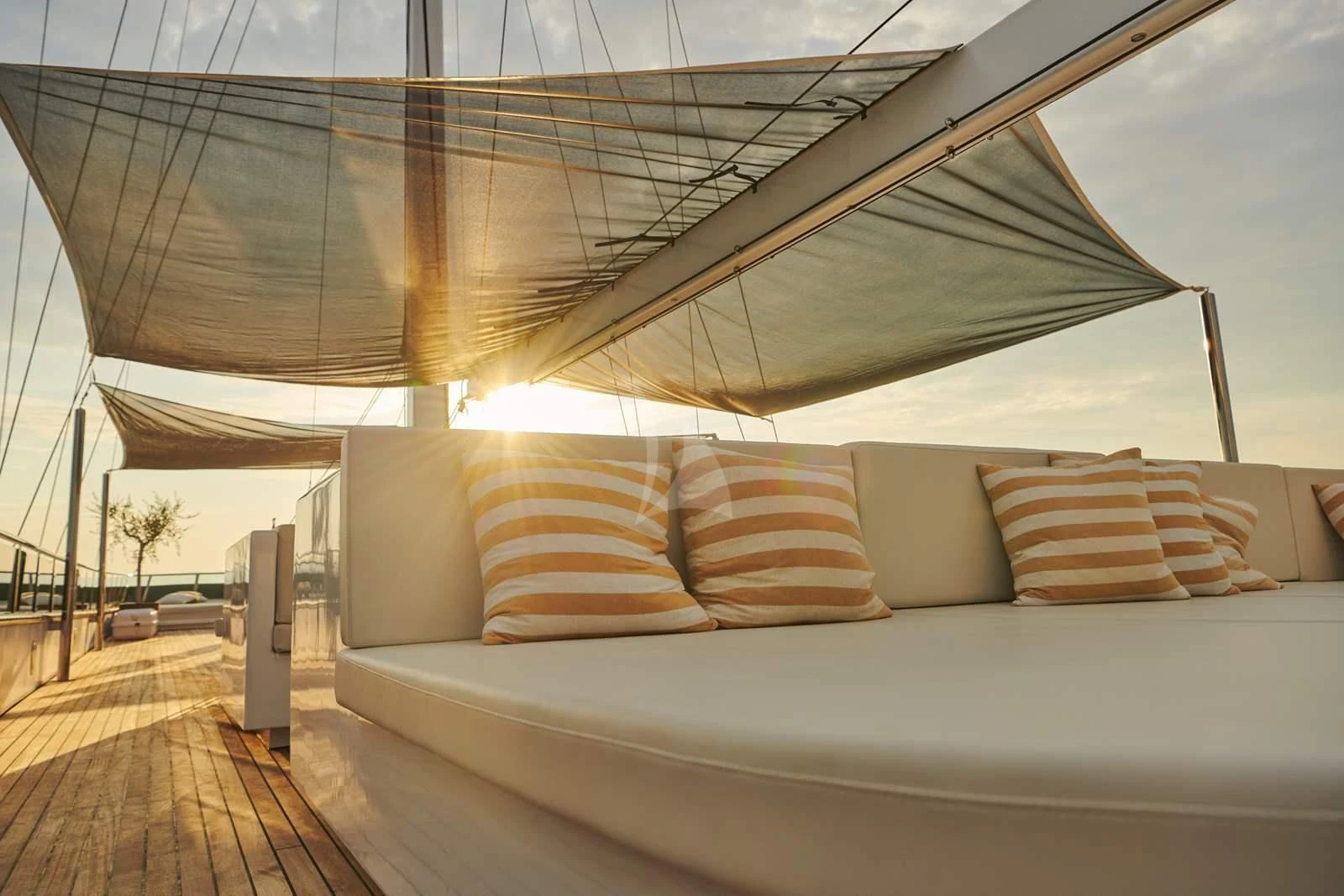 a couch with pillows on it aboard ANIMA MARIS Yacht for Sale