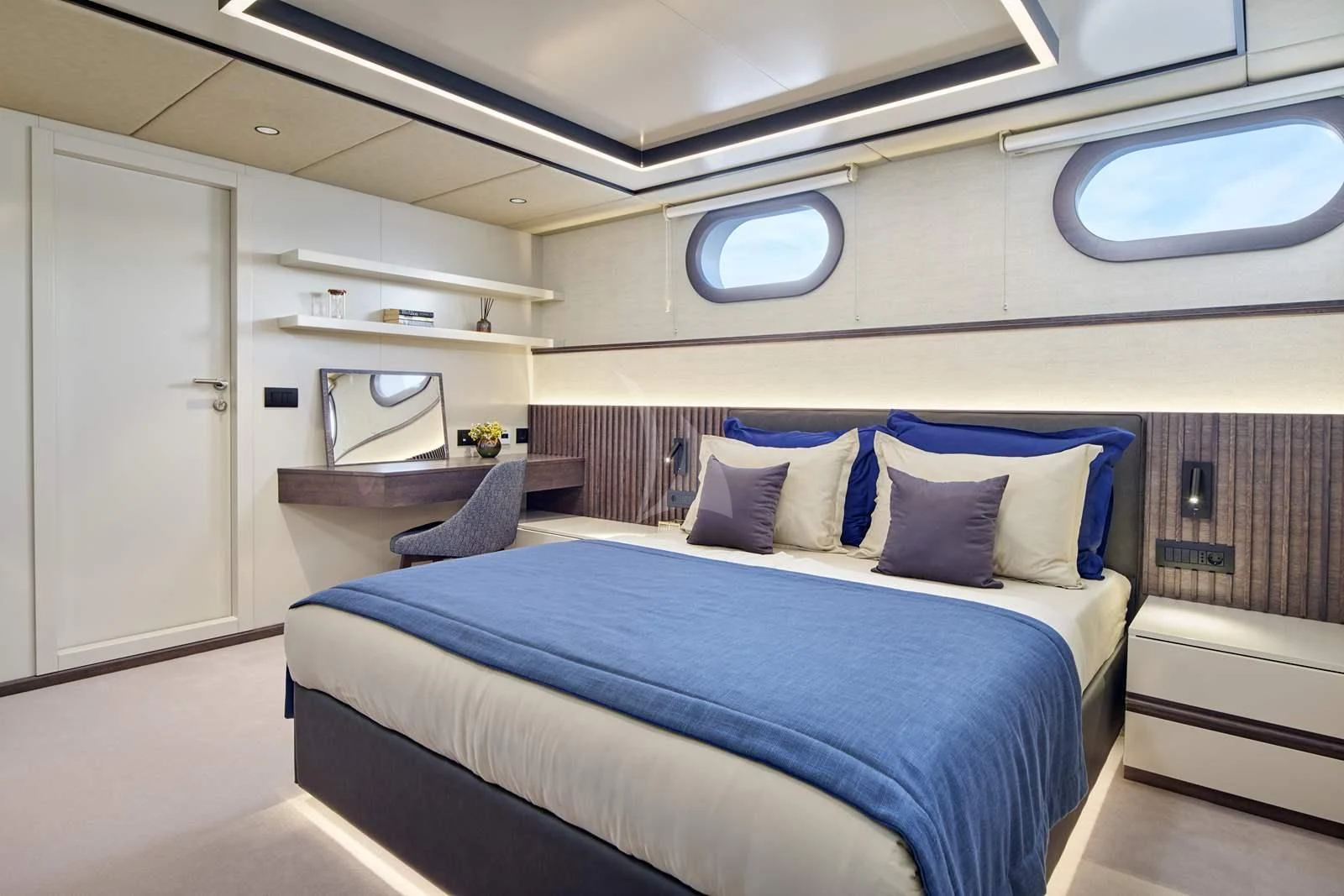 a room with a bed and a desk aboard ANIMA MARIS Yacht for Sale