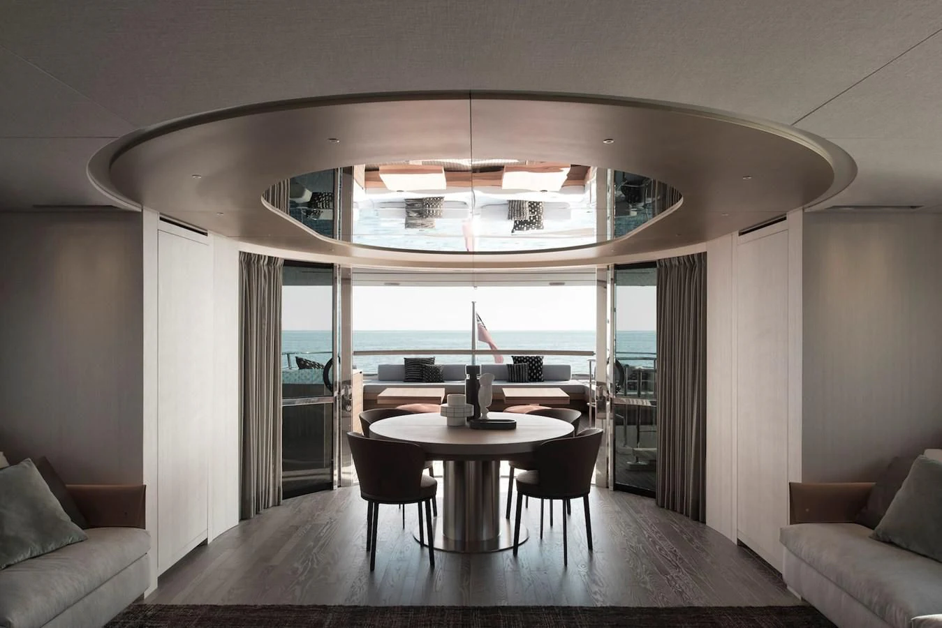 a room with a table and chairs aboard NADHIRA Yacht for Sale