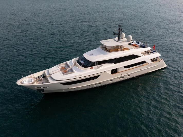 a white boat in the water aboard NADHIRA Yacht for Sale