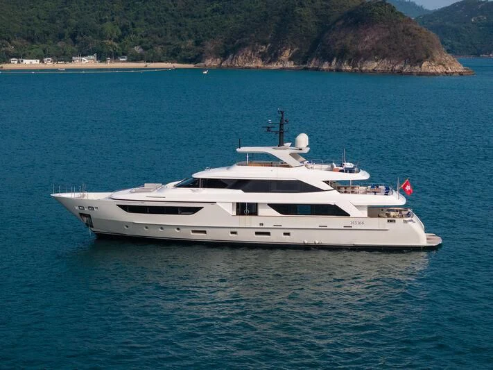 a white yacht in the water aboard NADHIRA Yacht for Sale
