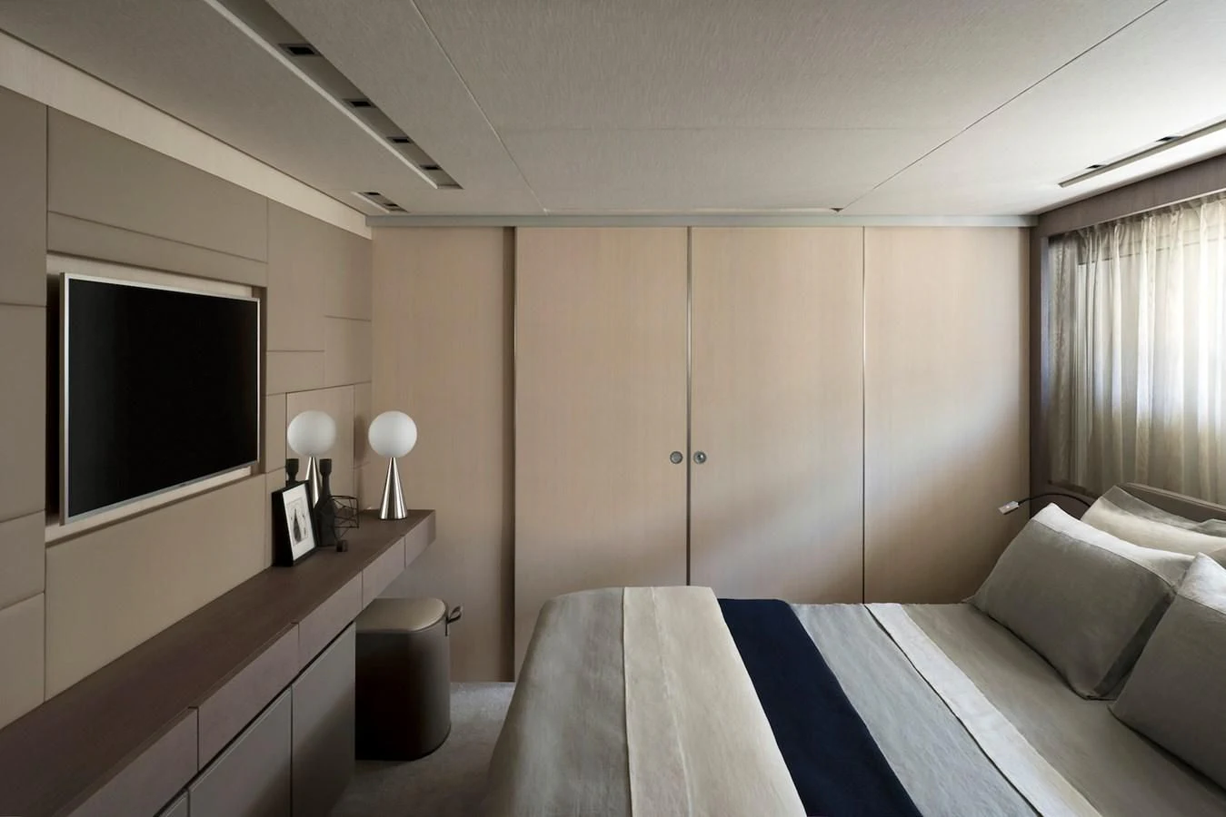 a room with a bed and a television aboard NADHIRA Yacht for Sale