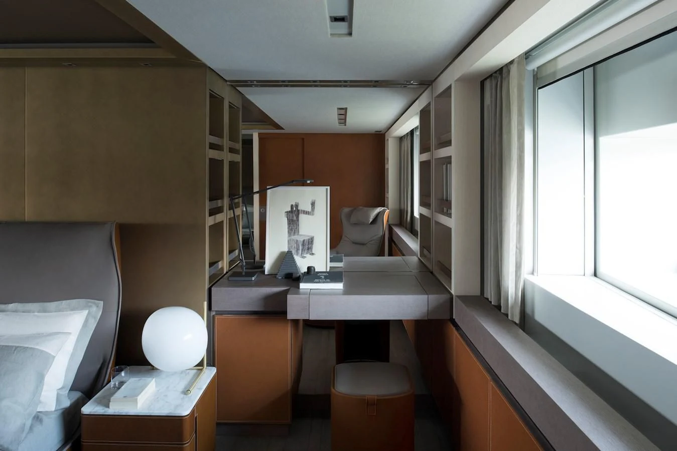 a room with a desk and a window aboard NADHIRA Yacht for Sale