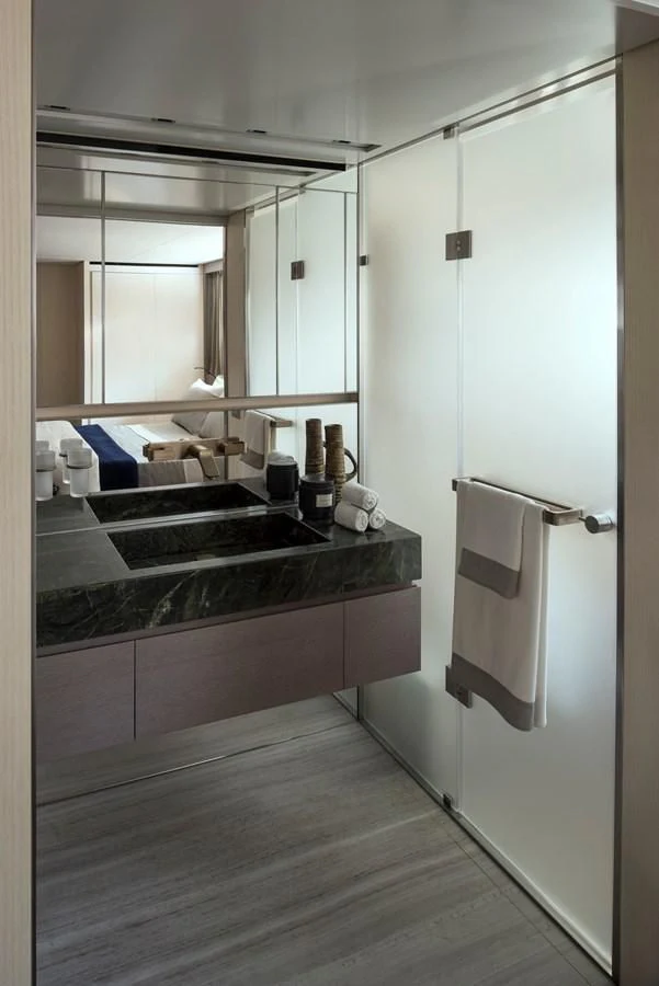 a bathroom with a large mirror aboard NADHIRA Yacht for Sale