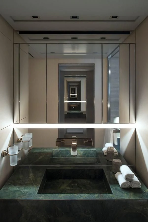 a large bathroom with a jacuzzi aboard NADHIRA Yacht for Sale