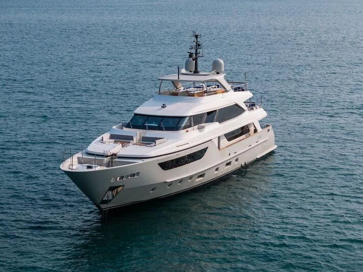 a white boat in the water aboard NADHIRA Yacht for Sale