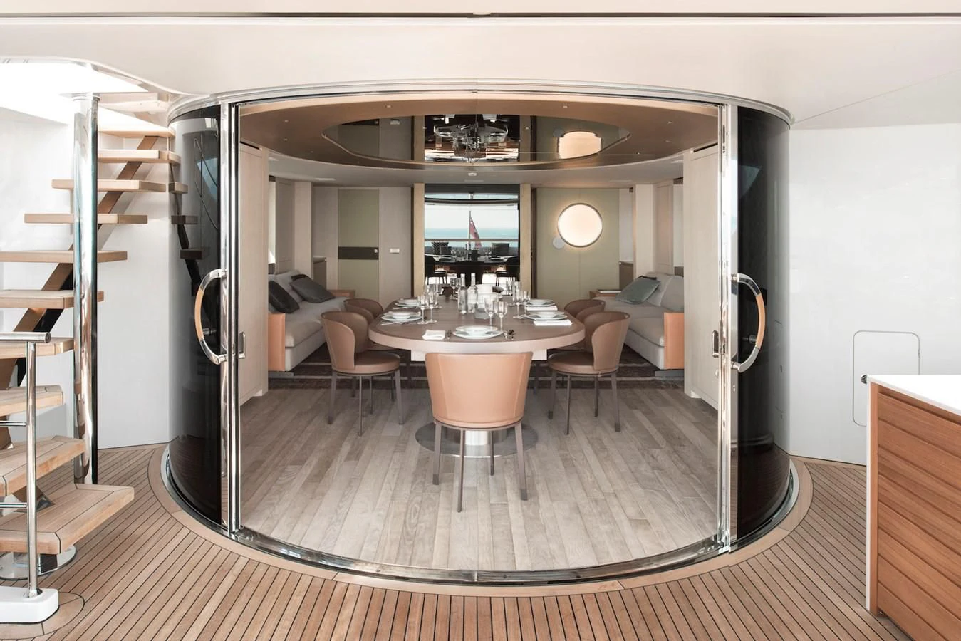 a large room with a table and chairs aboard NADHIRA Yacht for Sale