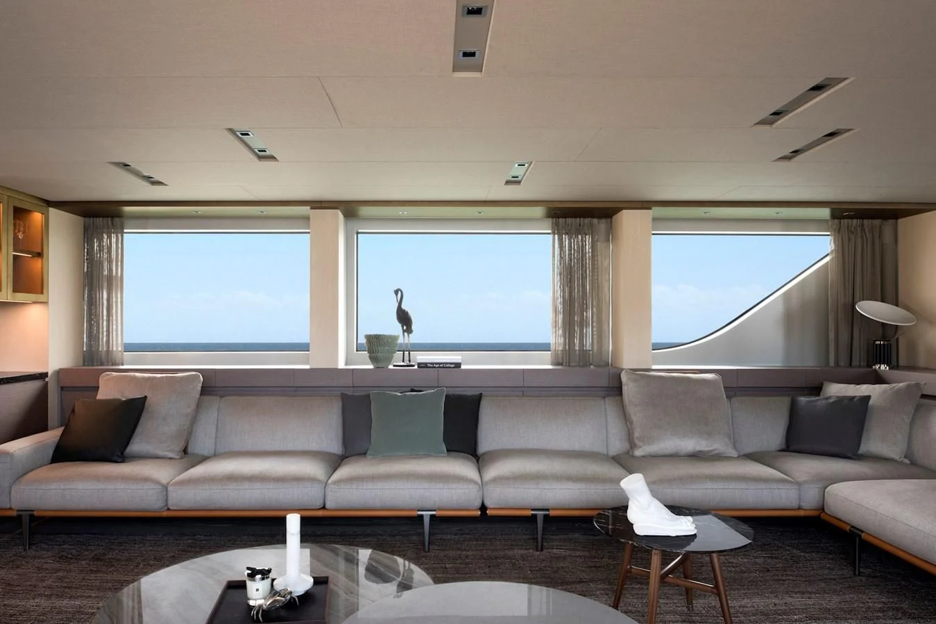 a living room with a large window aboard NADHIRA Yacht for Sale