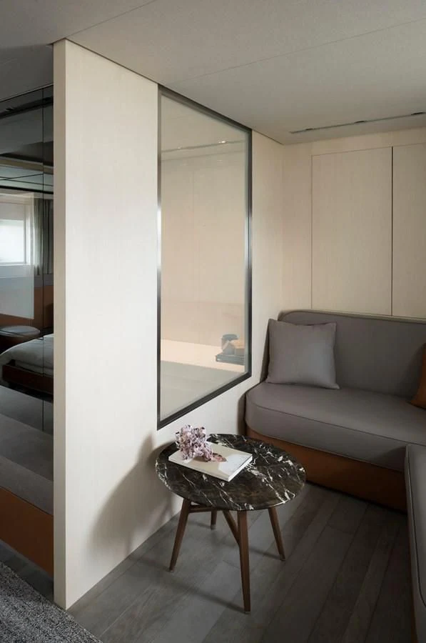 a living room with a large window aboard NADHIRA Yacht for Sale
