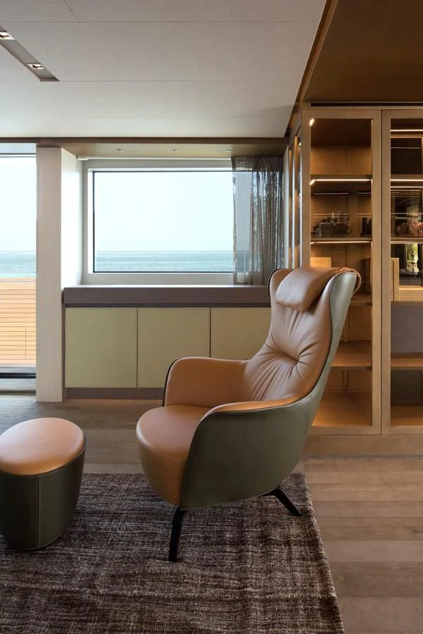 a chair in a room aboard NADHIRA Yacht for Sale