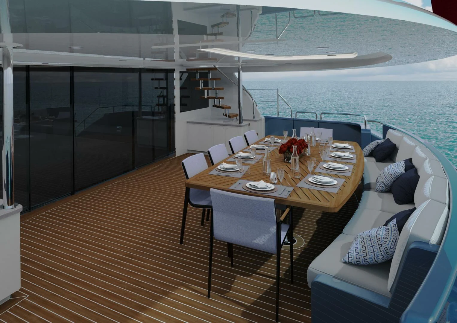 a table with chairs and a couch on a deck with a view of the ocean aboard STELLARCAT SF2603 Yacht for Sale