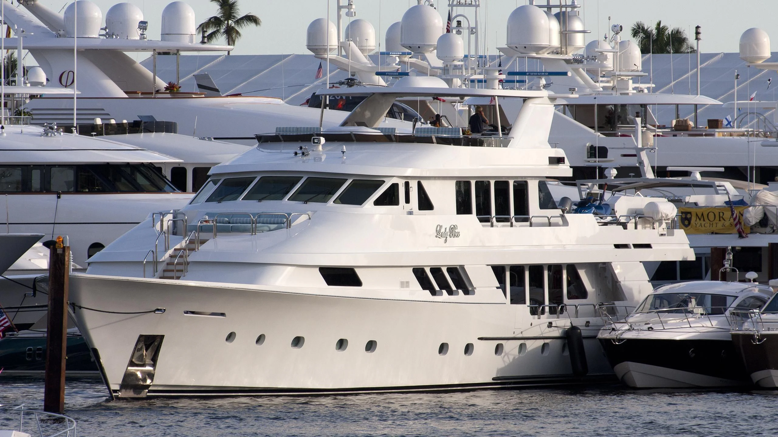 a group of boats are parked in the water aboard GRADE I Yacht for Charter