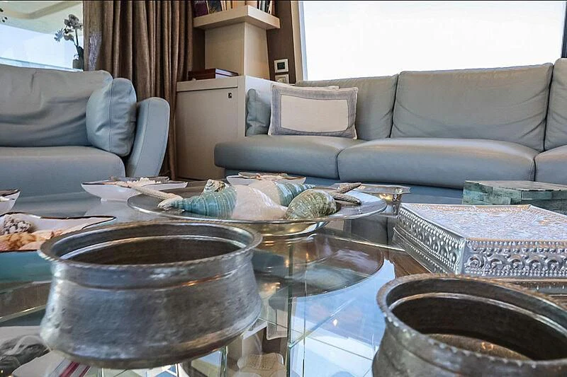 a living room with a couch and a table aboard RURI Yacht for Sale