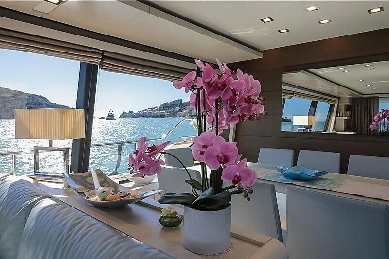 a vase of flowers on a table aboard RURI Yacht for Sale