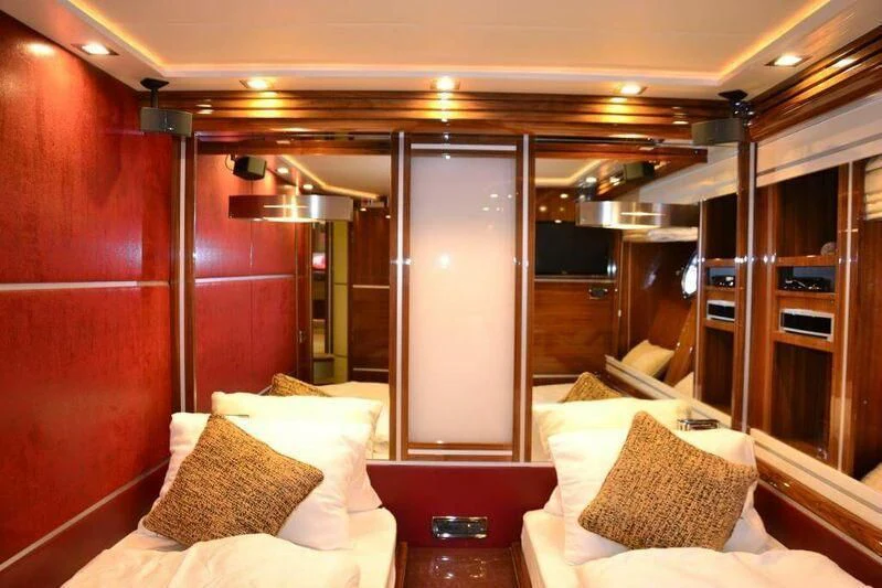 a room with a bed and a door aboard HITECH RACING Yacht for Sale