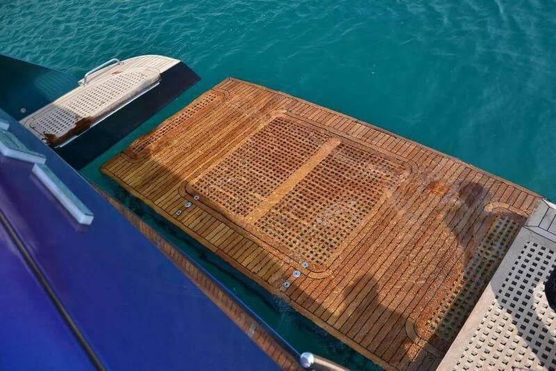 a wooden boat on the water aboard HITECH RACING Yacht for Sale
