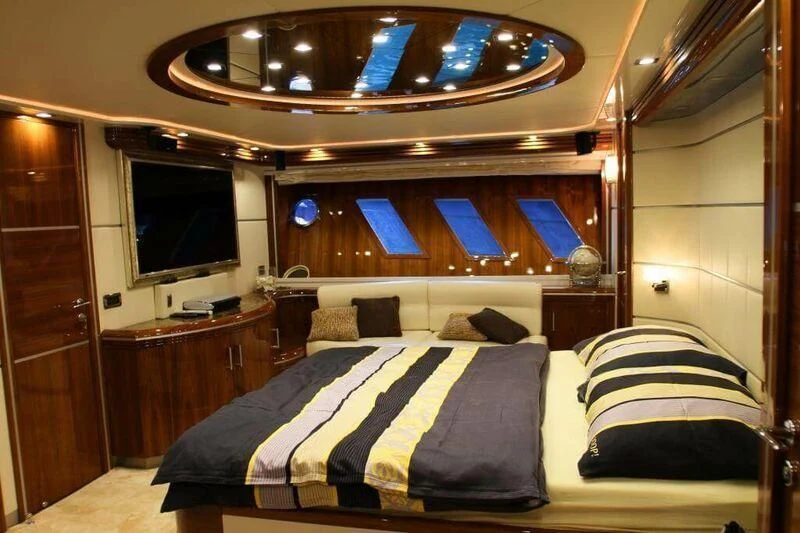 a bed in a room aboard HITECH RACING Yacht for Sale