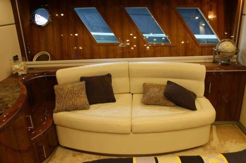 a couch with pillows and pillows aboard HITECH RACING Yacht for Sale