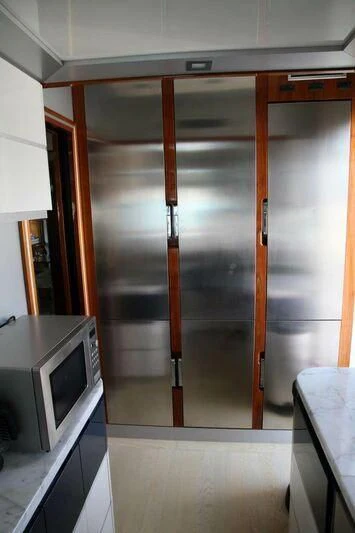 a microwave oven in a kitchen aboard HITECH RACING Yacht for Sale